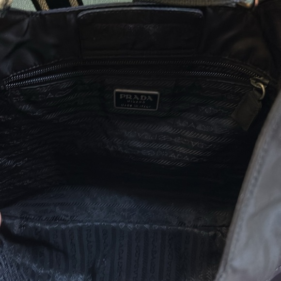 This is a black Prada crossbody with matching wallet. - Picture 4 of 8